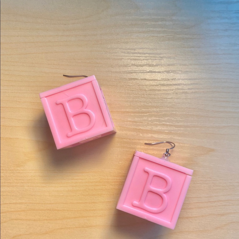 baby pink earrings w/ secret compartment :)